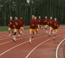 Groupe de coureurs sur une piste d'athlétisme