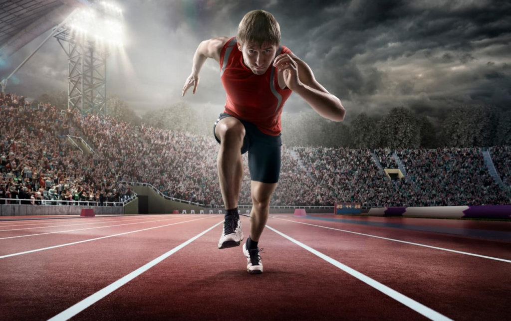 Un homme court sur une piste d'athlétisme